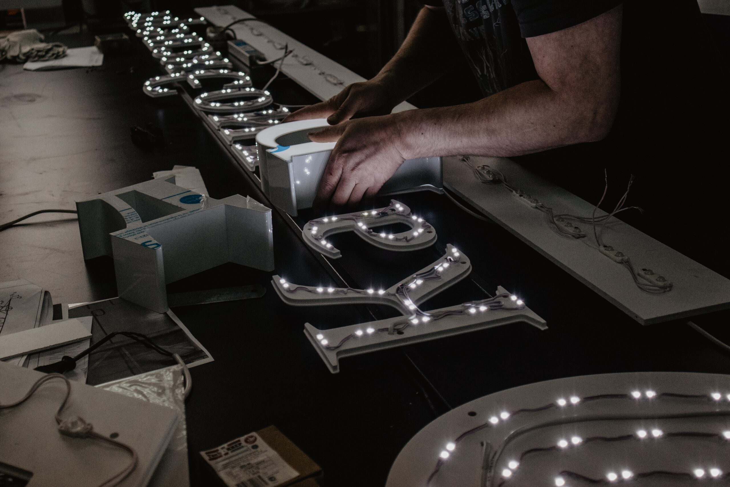 man-building-illuminated-sign-letters
