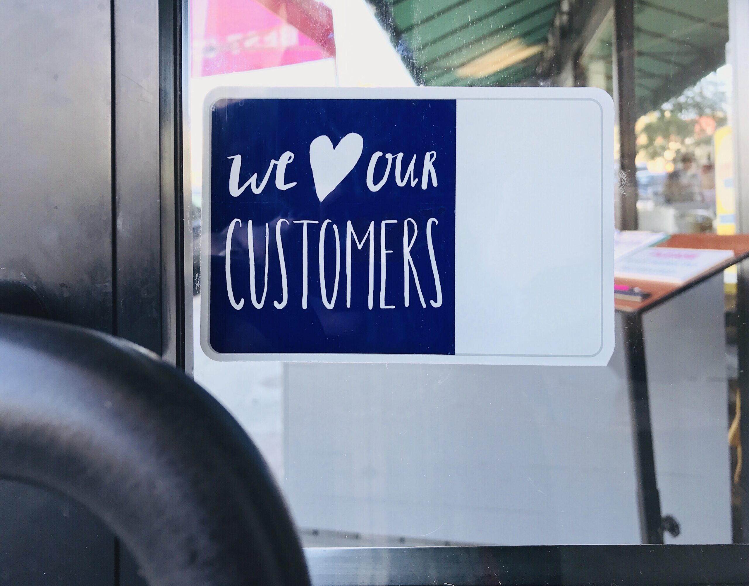 love-our-customers-sign-on-glass-door